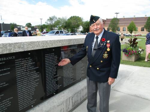 Supplied
                                At the Wall of Remembrance in Brandon, where his name is among those of local military veterans.