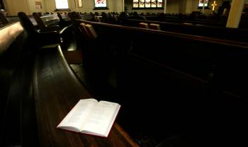 MIKE DEAL / FREE PRESS FILES
                                A song book sits in a pew at the Augustine United Church.