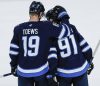 John Woods / THE CANADIAN PRESS
                                Winnipeg Jets&rsquo; Jonathan Toews consoles Cole Perfetti at the end of their 6-1 loss to the San Jose Sharks on the Jets&rsquo; final game of the season, Thursday.