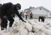JOHN WOODS / THE CANADIAN PRESS
                                Sandbags are placed around a home at Peguis First Nation on Thursday.