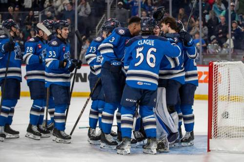 BROOK JONES / FREE PRESS

Manitoba Moose players congratulate goaltender Domenic Divincentiis (No. 50) on the team’s 2-1 victory over the Milwaukee Admirals on Friday.