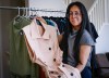 Clothing designer Nina Kharey shows off some of her designs at her home in Calgary, Tuesday, April 21, 2026.THE CANADIAN PRESS/Jeff McIntosh