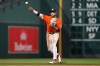 Houston Astros shortstop Jeremy Peña (3) throws to first to out Los Angeles Angels' Zach Neto during the fourth inning of a baseball game in Houston, Friday, March 27, 2026. (AP Photo/Ashley Landis)