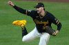 Pittsburgh Pirates pitcher Paul Skenes follows through on a pitch during the sixth inning of a baseball game against the San Diego Padres in Pittsburgh, Tuesday, April 7, 2026. (AP Photo/Gene J. Puskar)
