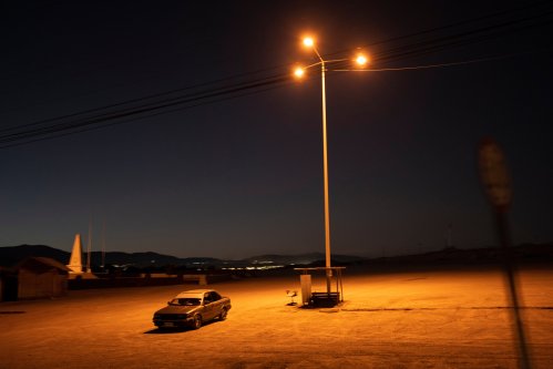 FILE - A driver sits in his car in an empty parking lot in Calama, Chile, Friday, April 14, 2023. (AP Photo/Rodrigo Abd, File)