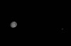 This image provided by NASA, the Artemis II crew captured this view the Moon and Earth are shown on Monday, April 6, 2026. (NASA via AP)