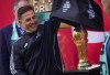 Italian soccer legend and 2006 World Cup winner Fabio Cannavaro helps unveil the FIFA World Cup trophy during the launch of a trophy tour, in Vancouver, on Friday, April 10, 2026. THE CANADIAN PRESS/Darryl Dyck