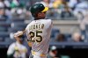 Athletics' Brent Rooker swings at a strike, and then left the game following the at bat, during the first inning of a baseball game against the New York Yankees, Thursday, April 9, 2026, in New York. (AP Photo/Adam Hunger)