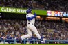 Los Angeles Dodgers' Max Muncy hits a walk off solo home run during the ninth inning of a baseball game against the Texas Rangers, Friday, April 10, 2026, in Los Angeles. (AP Photo/Mark J. Terrill)