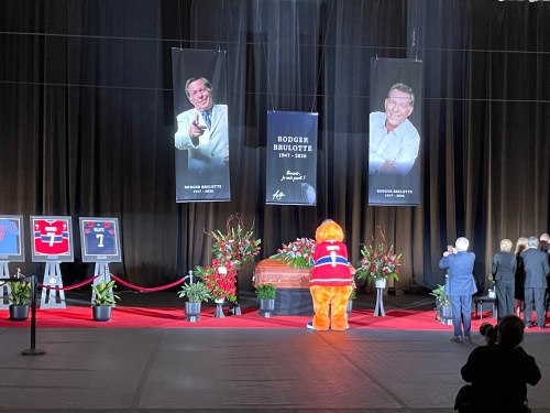 Former baseball commentator Rodger Brulotte's casket was at the IGA Stadium in Montreal on Thursday for a public viewing, April 9, 2026. Even the mascot Youppi came to pay his respects. THE CANADIAN PRESS/Sébastien Auger