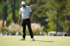 Scottie Scheffler reacts after missing a putt on the third hole during the second round of the Masters golf tournament at the Augusta National Golf Club, Friday, April 10, 2026, in Augusta, Ga. (AP Photo/Ashley Landis)