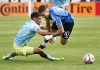 CF Montreal's Ivan Jaime (10) is upended by Philadelphia Union's Japhet Sery (5) during first half MLS soccer action in Montreal, Saturday, April 11, 2026. THE CANADIAN PRESS/Graham Hughes