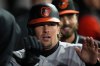 Baltimore Orioles' Adley Rutschman (35) celebrates after scoring on a single from Tyler O'Neill (9) during the fourth inning of a baseball game against the Chicago White Sox, Monday, April 6, 2026, in Chicago. (AP Photo/Erin Hooley)