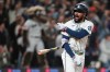 Seattle Mariners' J.P. Crawford reacts to hitting a game-winning RBI single to score Cole Young against the Houston Astros during the ninth inning of a baseball game, Saturday, April 11, 2026, in Seattle. (AP Photo/Lindsey Wasson)