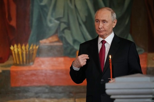 Russian President Vladimir Putin crosses himself during the Orthodox Easter service at the Cathedral of Christ the Saviour in Moscow, early Sunday, April 12, 2026. (AP Photo/Alexander Zemlianichenko, Pool)