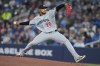 Minnesota Twins pitcher Taj Bradley (26) throws against the Toronto Blue Jays during first inning American League MLB baseball action in Toronto on Sunday, April 12, 2026. THE CANADIAN PRESS/Nathan Denette