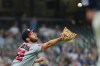Washington Nationals' Ken Waldichuk reaches for a popup bunt during the sixth inning of a baseball game against the Milwaukee Brewers, Sunday, April 12, 2026, in Milwaukee. (AP Photo/Aaron Gash)