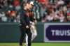 Baltimore Orioles' Ryan Mountcastle, right, leaves the field after an injury on a double during the second inning of a baseball game against the San Francisco Giants, Saturday, April 11, 2026, in Baltimore. (AP Photo/Stephanie Scarbrough)