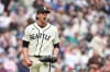 Seattle Mariners starting pitcher Logan Gilbert reacts after Houston Astros' Isaac Paredes hit into a double play to end the top of the sixth inning of a baseball game, Sunday, April 12, 2026, in Seattle. (AP Photo/Lindsey Wasson)
