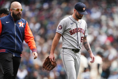 Houston Astros starting pitcher Cody Bolton leaves the game against the Seattle Marinersdue to injury with a trainer during the second inning of a baseball game, Sunday, April 12, 2026, in Seattle. (AP Photo/Lindsey Wasson)