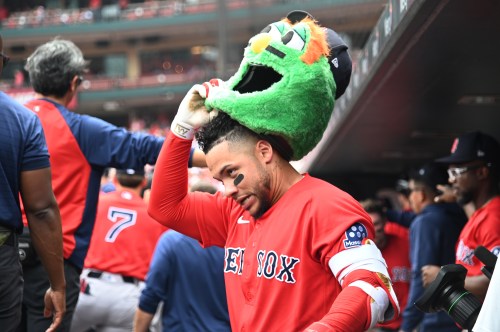 Boston Red Sox's Willson Contreras celebrates in the dugout after hitting a two-run home run in the inning of a baseball game against the St. Louis Cardinals, Sunday, April 12, 2026, in St. Louis. (AP Photo/Michael Thomas)