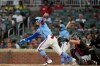 Atlanta Braves' Mauricio Dubón (14) hits an RBI-double against the Cleveland Guardians int her second inning of a baseball game, Sunday, April 12, 2026, in Atlanta. (AP Photo/Mike Stewart)