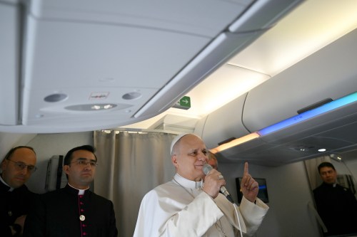 Pope Leo XIV speaks to journalists aboard his flight bound for Algiers’ Houari Boumédiène International Airport on Monday, April 13, 2026, at the start of an 11-day apostolic journey to Africa. (Alberto Pizzoli/Pool Photo via AP)