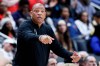 Milwaukee Bucks head coach Doc Rivers directs his payers against the Detroit Pistons during the first half of an NBA basketball game Wednesday, April 8, 2026, in Detroit. (AP Photo/Duane Burleson)