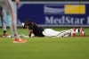 Baltimore Orioles' Ryan Mountcastle reacts to an injury after hitting a double during the second inning of a baseball game against the San Francisco Giants, Saturday, April 11, 2026, in Baltimore. (AP Photo/Stephanie Scarbrough)