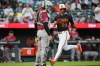 Baltimore Orioles' Blaze Alexander (23) scores past Arizona Diamondbacks catcher Adrian del Castillo, left, on an RBI triple hit by Orioles' Gunnar Henderson during the third inning of a baseball game, Monday, April 13, 2026, in Baltimore. (AP Photo/Stephanie Scarbrough)
