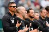 Chicago White Sox manager Will Venable, left, stands for the national anthem before a baseball game against the Chicago White Sox, Sunday, April 12, 2026, in Kansas City, Mo. (AP Photo/Charlie Riedel)