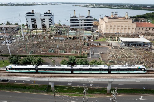 Needs copyright confirmation - A Skyline train passes in front of the Waiau Power Plant on Thursday, April 2, 2026, in Pearl City, Hawaii. (Craig Fujii/Honolulu Civil Beat via AP)
