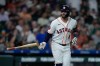 Houston Astros' Christian Walker tosses his bat after hitting a solo home run during the second inning of a baseball game against the Colorado Rockies, Tuesday, April 14, 2026, in Houston. (AP Photo/Kevin M. Cox)
