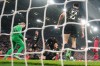 PSG's goalkeeper Matvey Safonov and Marquinhos react after a save during the Champions League quarterfinal second leg soccer match between Liverpool and Paris Saint-Germain in Liverpool, England, Thursday, April 14, 2026. (AP Photo/Jon Super)