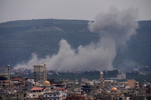Smoke rises following an Israeli airstrike on the village of Qlaileh, as seen from the southern port city of Tyre, Lebanon, Wednesday, April 15, 2026. (AP Photo/Hussein Malla)