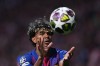 Barcelona's Lamine Yamal throws the ball during the Champions League quarterfinal second leg soccer match between Atletico Madrid and Barcelona in Madrid, Spain, Tuesday, April 14, 2026. (AP Photo/Manu Fernandez)