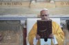 Pope Leo XIV holds the Gospel Book as he celebrates a Mass in the Saint Augustine Basilica in Annaba, Algeria, Tuesday, April 14, 2026, on the second day of an 11-day apostolic journey to Africa. (AP Photo/Andrew Medichini)