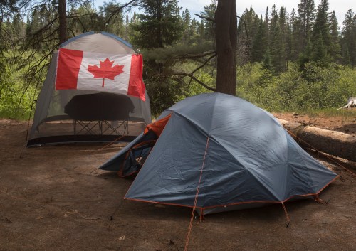 Campers with Canadian flag flying on their camp site are shown in Algonquin Park Saturday June 12, 2021. THE CANADIAN PRESS/Fred Thornhill