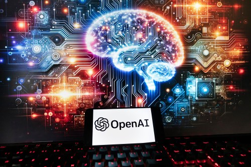 FILE - The OpenAI logo is displayed on a cell phone with an image on a computer monitor generated by ChatGPT's Dall-E text-to-image model, Friday, Dec. 8, 2023, in Boston. (AP Photo/Michael Dwyer, File)