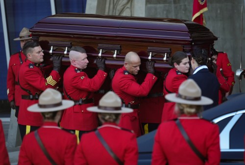 Pallbearers in red serge carry RCMP Const. Shaelyn Yang's casket to a hearse after her regimental funeral, in Richmond, B.C., on Wednesday, Nov. 2, 2022. THE CANADIAN PRESS/Darryl Dyck