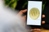 An app screenshot for Wealthsimple is seen on a smartphone in a photo illustration made in Toronto, Monday, June 17, 2024. THE CANADIAN PRESS/Giordano Ciampini