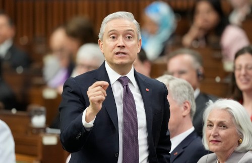 Finance and National Revenue Minister Francois-Philippe Champagne rises during question period on Parliament Hill in Ottawa, Tuesday, April 14, 2026. THE CANADIAN PRESS/Adrian Wyld