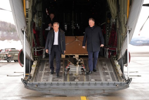 Prime Minister Mark Carney steps off a Canadian Forces CC-130 Hercules plane with Secretary of State (Defence Procurement) Stephen Fuhr as he arrives in Bardufoss, Norway, Friday, March 13, 2026. THE CANADIAN PRESS/Adrian Wyld