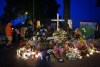 People hold a candlelight march during a vigil on the street where a vehicle-ramming attack occurred at the Filipino community's Lapu Lapu Day festival last week, on a provincial day of mourning for the victims, in Vancouver, on Friday, May 2, 2025. THE CANADIAN PRESS/Darryl Dyck