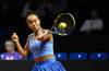 Canada's Leylah Fernandez hits a return to Kazakhstan's Elena Rybakina in the quarterfinal of the Stuttgart Open tennis tournament, Friday, April 17, 2026,  in Stuttgart, Germany. (Katharina Kausche/dpa via AP)