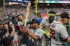 Atlanta Braves' Dominic Smith, center, celebrates after hitting a home run off Philadelphia Phillies pitcher Taijuan Walker during the third inning of a baseball game, Friday, April 17, 2026, in Philadelphia. (AP Photo/Matt Rourke)