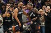 Phoenix Suns forward Dillon Brooks and guard Jalen Green (4) celebrate after defeating the Golden State Warriors during an NBA basketball play-in tournament game, Friday, April 17, 2026, in Phoenix. (AP Photo/Rick Scuteri)