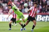 Fulham's Sasa Lukic, left, and Brentford's Kevin Schade battle for the ball during the English Premier League soccer match between Brentford and Fulham in Brentford, England, Saturday April 18, 2026. (John Walton/PA via AP)