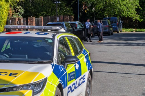 Police officers patrol at a cordon near Kenton United Synagogue in Harrow, a suburb of London, Sunday, April 19, 2026. (Jamie Lashmar/PA via AP)