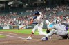 Houston Astros' Joey Loperfido (10) hits a RBI single as Colorado Rockies catcher Hunter Goodman (15) reaches for the pitch during the first inning of a baseball game Thursday, April 16, 2026, in Houston. (AP Photo/David J. Phillip)